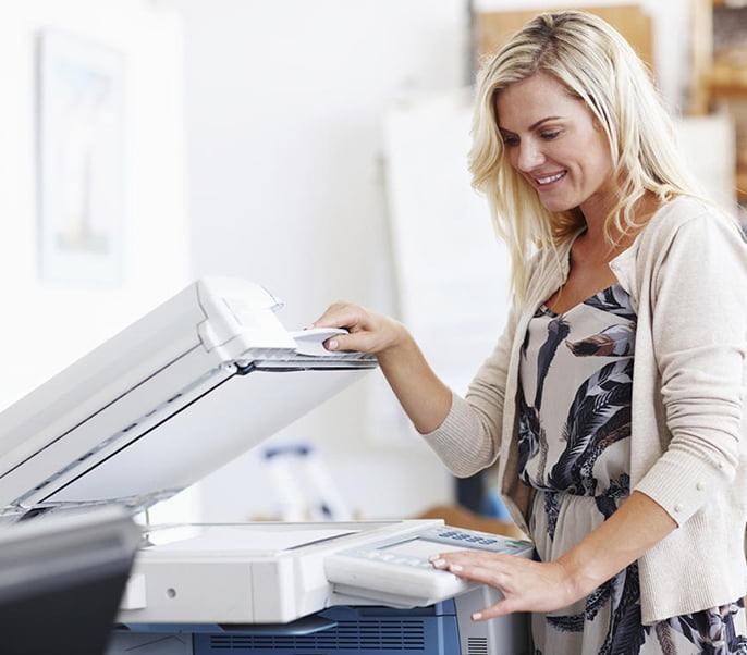 Woman Using a Fax Machine